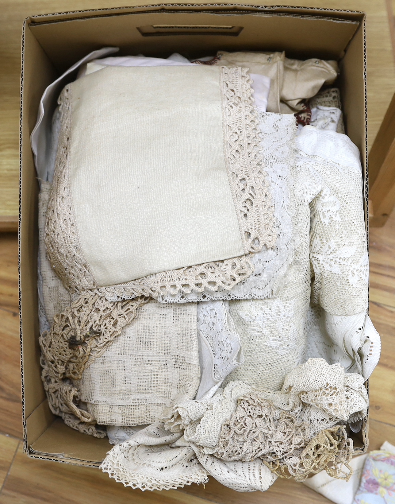 A collection of mostly 20th century machine lace curtaining together with similar lace edged linens